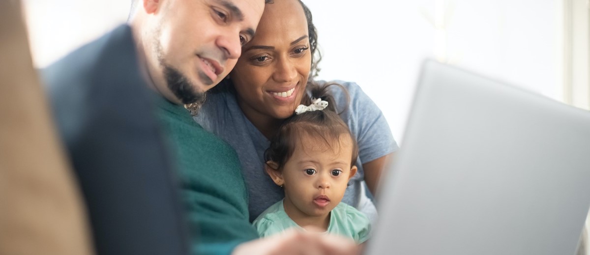 Family looking at a computer