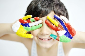 boy with paint on hands